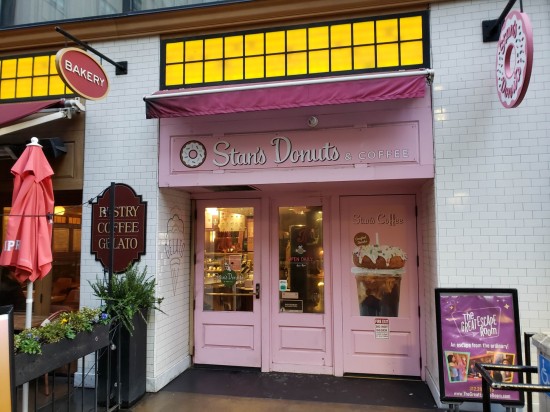 Stan's Donuts pink doorways. Signs read "Bakery" and "Pastry / Coffee / Gelato".