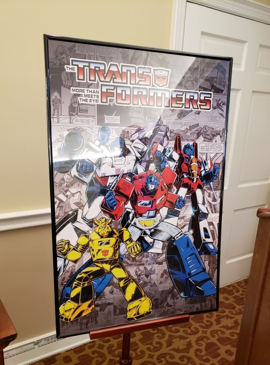 Framed transformers poster with Optimus Prime, Megatron, Bumblebee, Starscream and Shockwave.