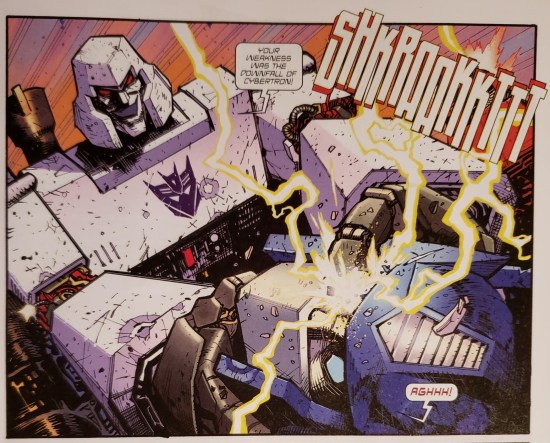 Megatron strangles Optimus Prime and gloats, "Your weakness was the downfall of Cybertron!"