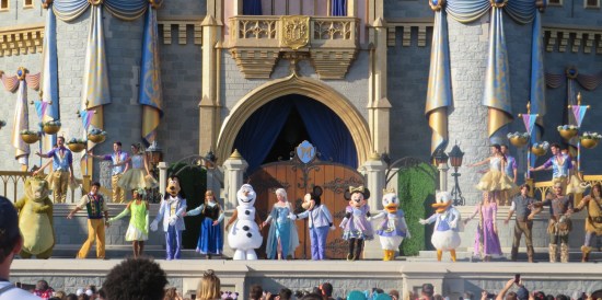 Same stage, now with at least 22 dancers preparing to bow at the end.