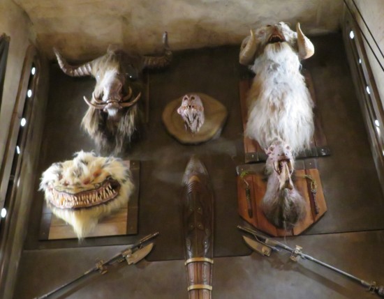 Mounted head of a Tauntaun, a Mexu, and three other Star Wars monsters, plus two poleaxes hanging below them.