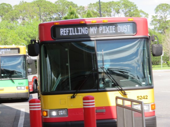 Front of Disney bus. Destination sign reads "Refilling My Pixie Dust".