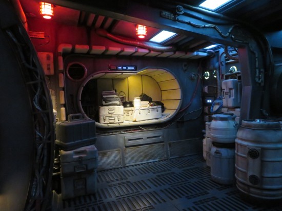 Space storage room with space cargo and a space cubbyhole containing space luggage.