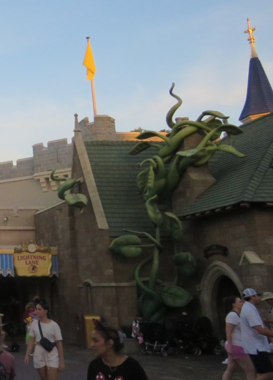 Beanstalk sculpted in a corner next to a shop.