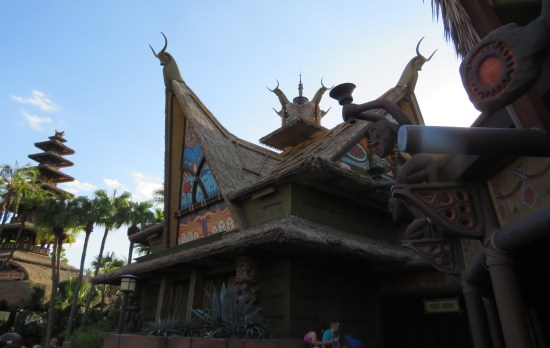 Worm's-eye shot of a simlauted Islander building with sharply gabled faux-straw roof.