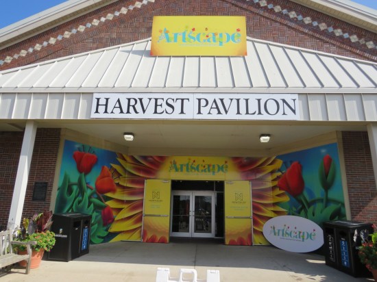 Harvest Pavilion entrance redecorated with Artscape signage and flowers painted on the outer walls.