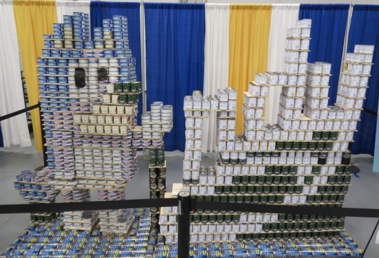 Bluey made of cans, next to the letters NDY also made of cans.