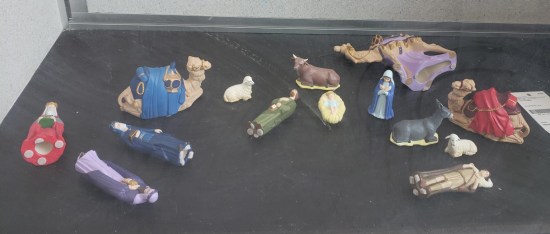Nativity scene but almost every figure has been knocked over except Mary.