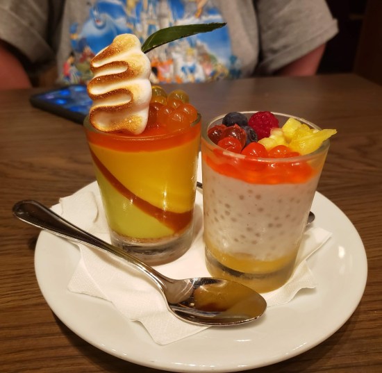 Two tiny glasses filled with fun ingredients in a whimsical presentation.