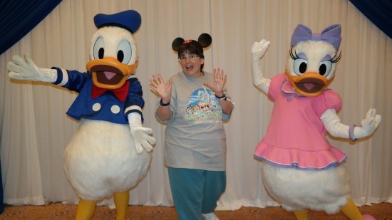 Anne doing jazz hands with Donald and Daisy Duck.