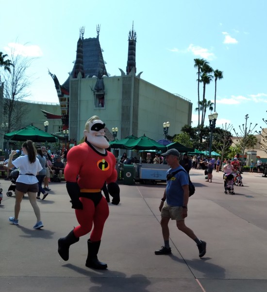 Mr. Incredible cast member walking past.