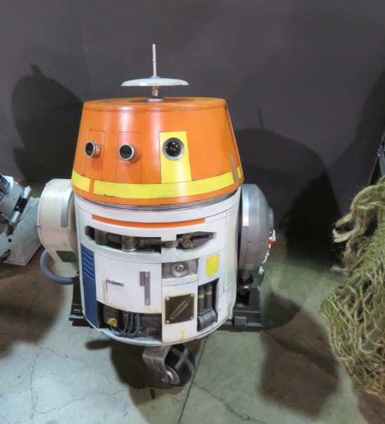 R5-D4 statue next to other Star Wars droid statues.