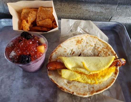 Food listed in caption, all served on a metal tray.
