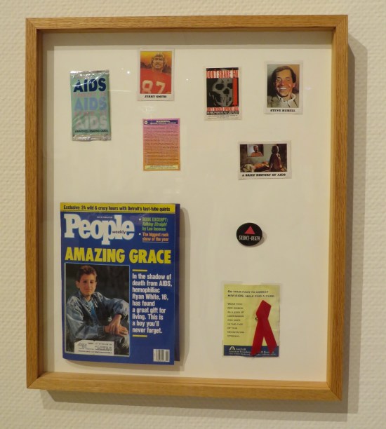 Collections of AIDs crisis trading cards and charity ribbons, alongside a People Magazine cover story on Ryan White.