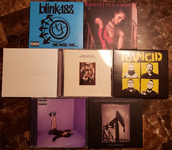 The covers of all seven albums reviewed in this entry, laid out on my kitchen table.