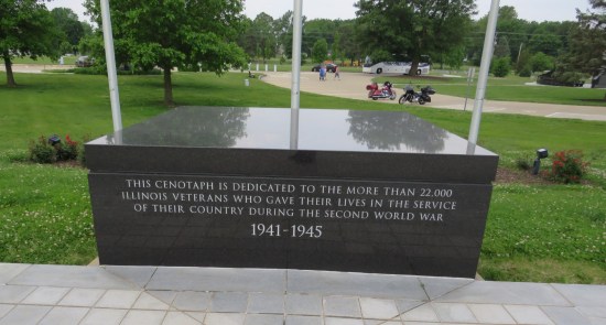Short black outdoor wall etched: "This cenotaph is dedicated to the more than 22,000 Illinois veterans who gave their lives in the service of their country during the Second World War."