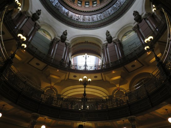 45-degree view from the rotunda floor up to the arched hallways on the second and third floors.