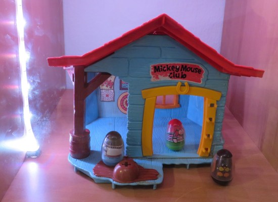 Three Weebles staged on a Mickey Mouse Clubhouse playset.