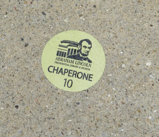 Sticker for the Abraham Lincoln Presidential Library and Museum, which was given to a Chaperone #10. Now it's stuck on a stone bench.