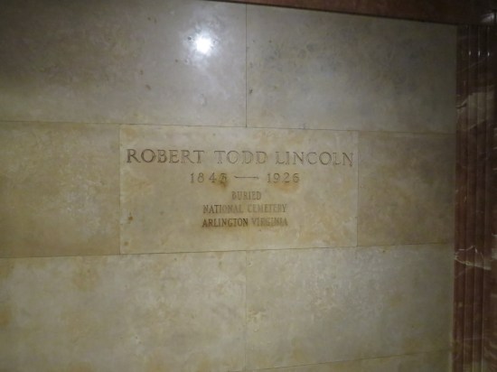 Off-white marker labeled "Robert Todd Lincoln 1846-1926 Buried National Cemetery Arlington Virginia".