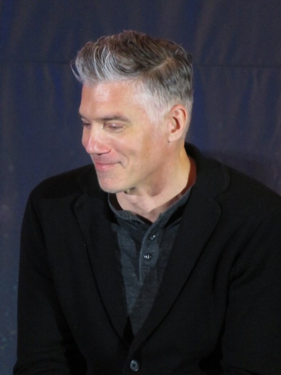 Anson Mount smiling onstage.