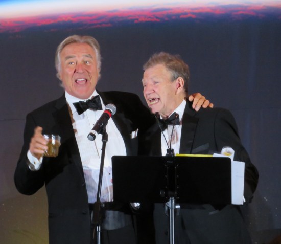 Casey Biggs and Max Grodenchik singing in tuxes.