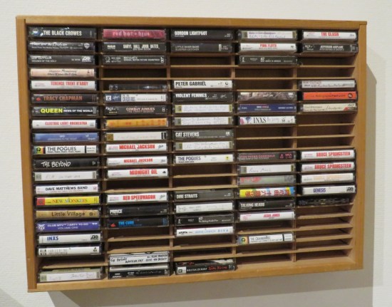 A cassette rack that could hold 100 of them. 28 of the slots are empty.