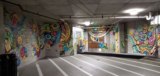 parking garage walls with otherworldly flowers or shells painted all over the walls.