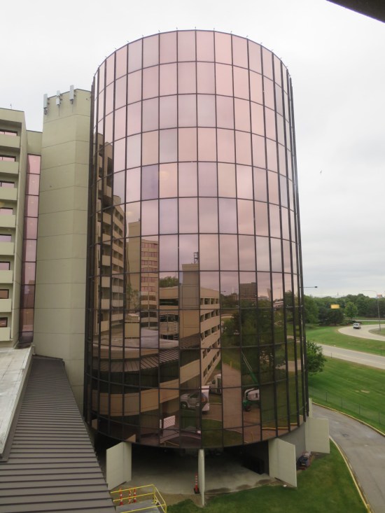 Hyatt Regency O'Hare tower, shiny and covered in rectangular mirrors.