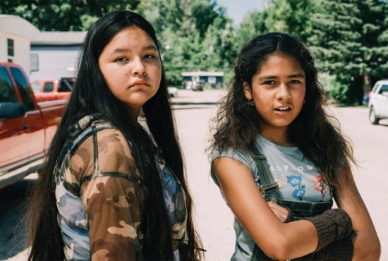 Two Lakota girls looking at the camera.