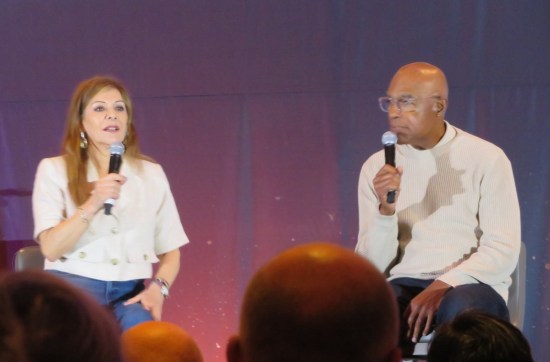 Marina Sirtis and Michael Dorn on a stage, sitting a bit far apart.