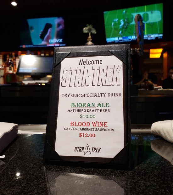 Drink menu featuring Trek-themed drinks called Bajoran Ale (misspelled) and Blood Wine.