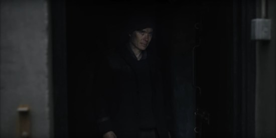 Cillian Murphy glowering from within the darkness of a coal shed.