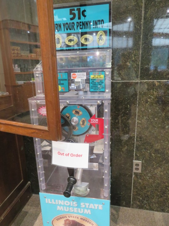 Illinois State Museum smashed penny machine with Out of Order sign.