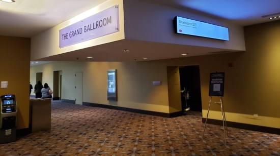 Digital signs directing guests to the Grand Ballroom, and one preempted by a MS Windows "Network Error" message.