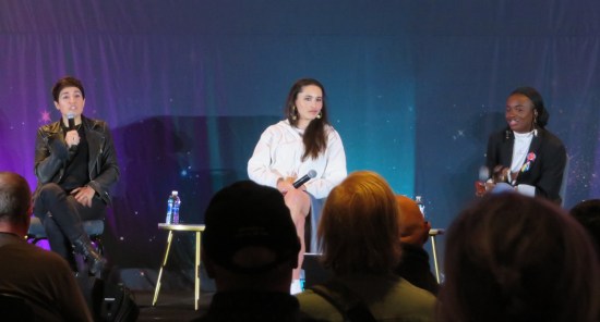 Three of the lead actresses from "Strange New Worlds" seated on stage, oddly far apart.