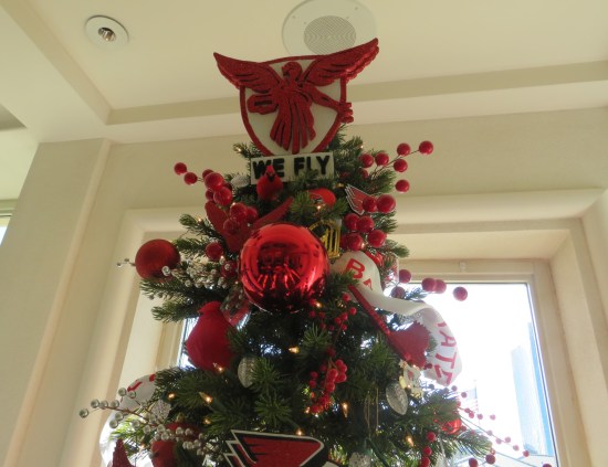 Christmas treetop with topper: red eagle on white shield, motto WE FLY.