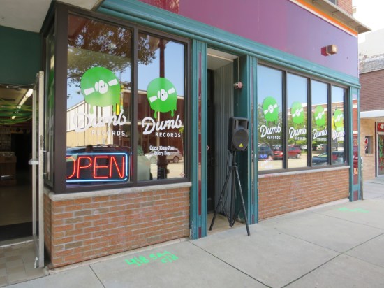 Dumb Records storefront, whose symbol is a melting green record.