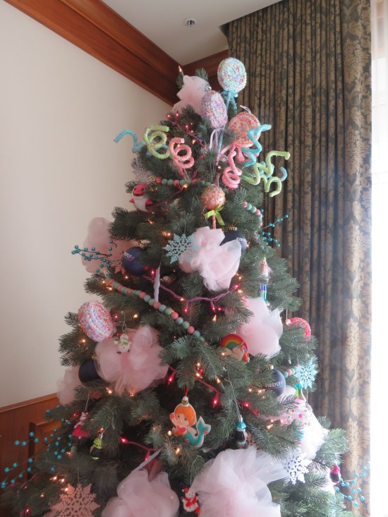 Christmas tree decorated with fake giant lollipops, spun sugar and cotton candy ribbons.