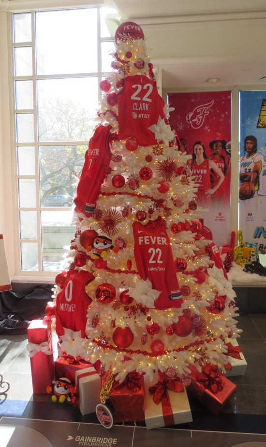 White Christmas tree covered in red Indiana Fever jerseys.