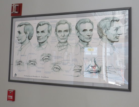 Large poster of drawings of Lincoln's head and facial features at different angles, labeled "Abraham Lincoln Modelsheet #1".