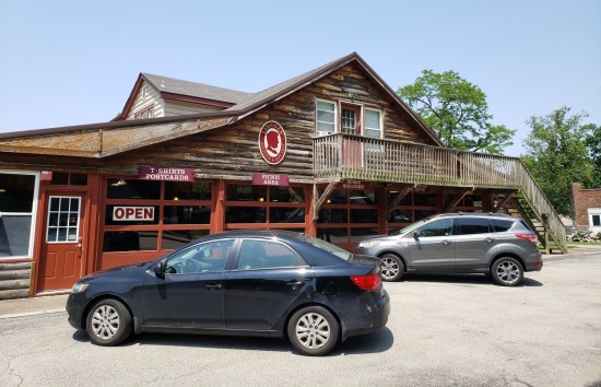 Large wood lodge turned into a gift shop. My 2011 Kia Forte is parked out front.