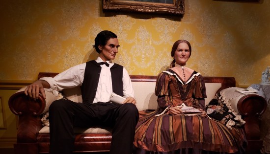 Statues of Lincoln and Mary Todd sitting on a couch, looking super uncomfortable.