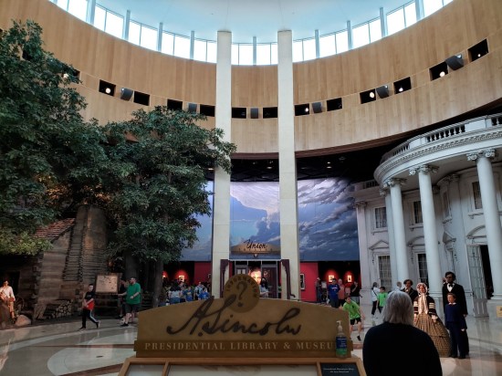 Lincoln museum rotunda with spokes leading to different exhibits. Ceiling is like three or four stories high.