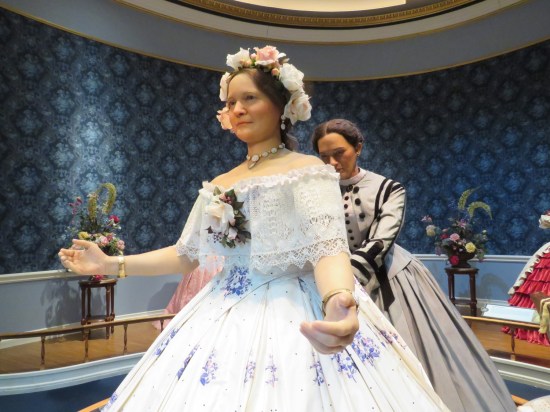 Statues: Mary Todd Lincoln trying on a dress while Elizabeth Keckley pins it in the back.