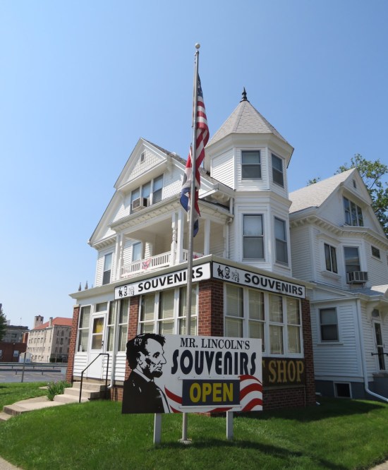 Three-story white Gothic house turned into a gift shop.