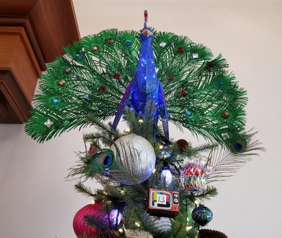 Christmas treetop with peacock, ornaments and tiny TV with Channel 13 test pattern