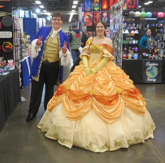 costumes: Disney's Beast in human form and Belle in orange ballgown.