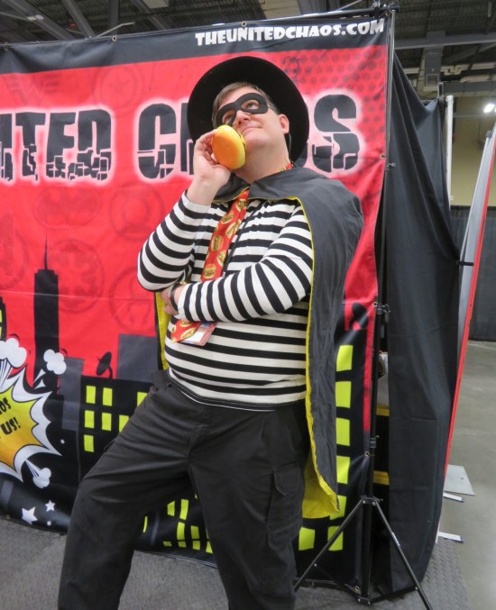 costume: McDonald's Hamburglar, holding a burger-shaped phone to his ear.