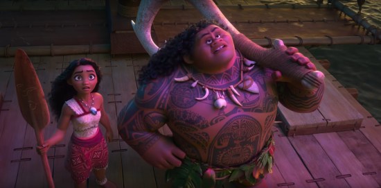 Moana holding an oar, Maui holding his giant hook, both standing on a boat and looking upward.